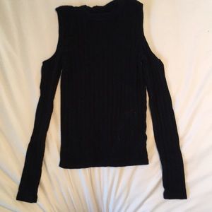 A black long sleeve shirt cut out by shoulders